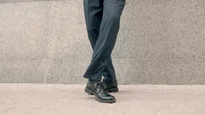 A person wearing comfortable work shoes, emphasizing the importance of footwear comfort in enhancing workplace productivity and well-being