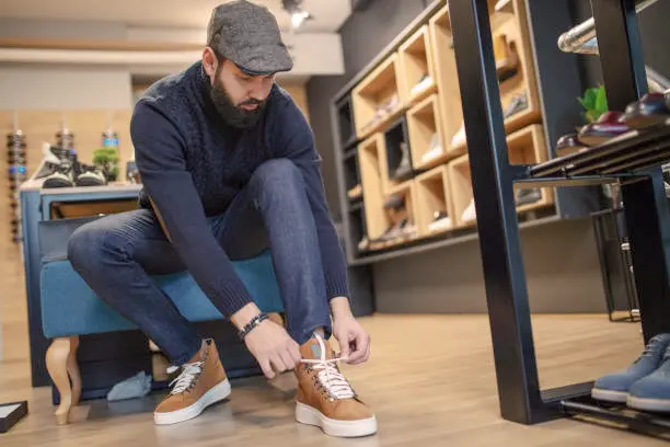 A skilled cobbler meticulously handcrafting a pair of shoes, embodying the artistry and tradition of footwear craftsmanship